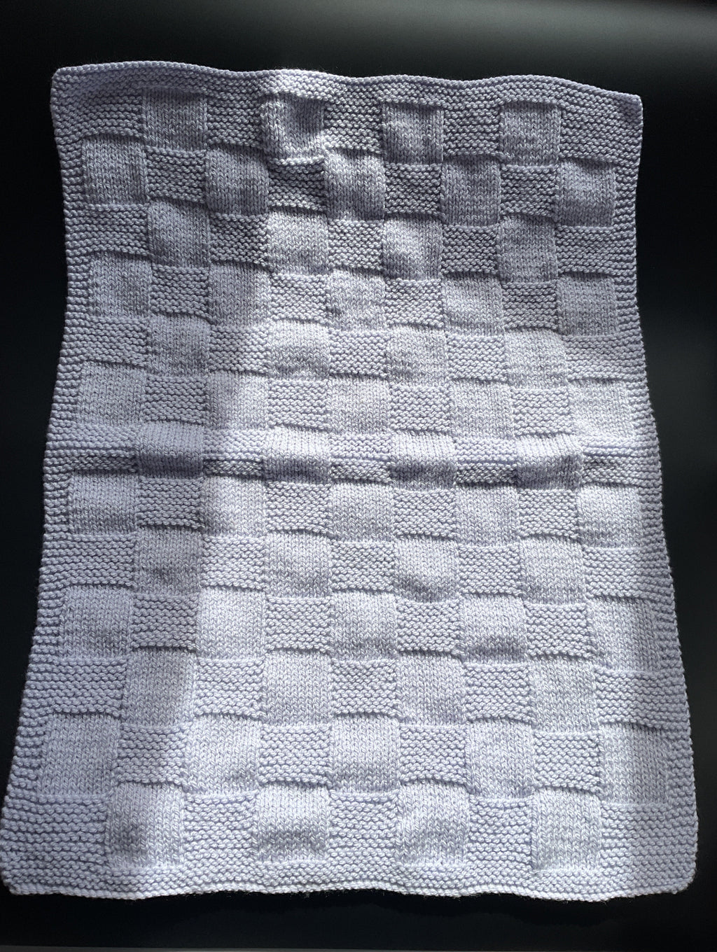 Chunky knitted lilac baby blanket