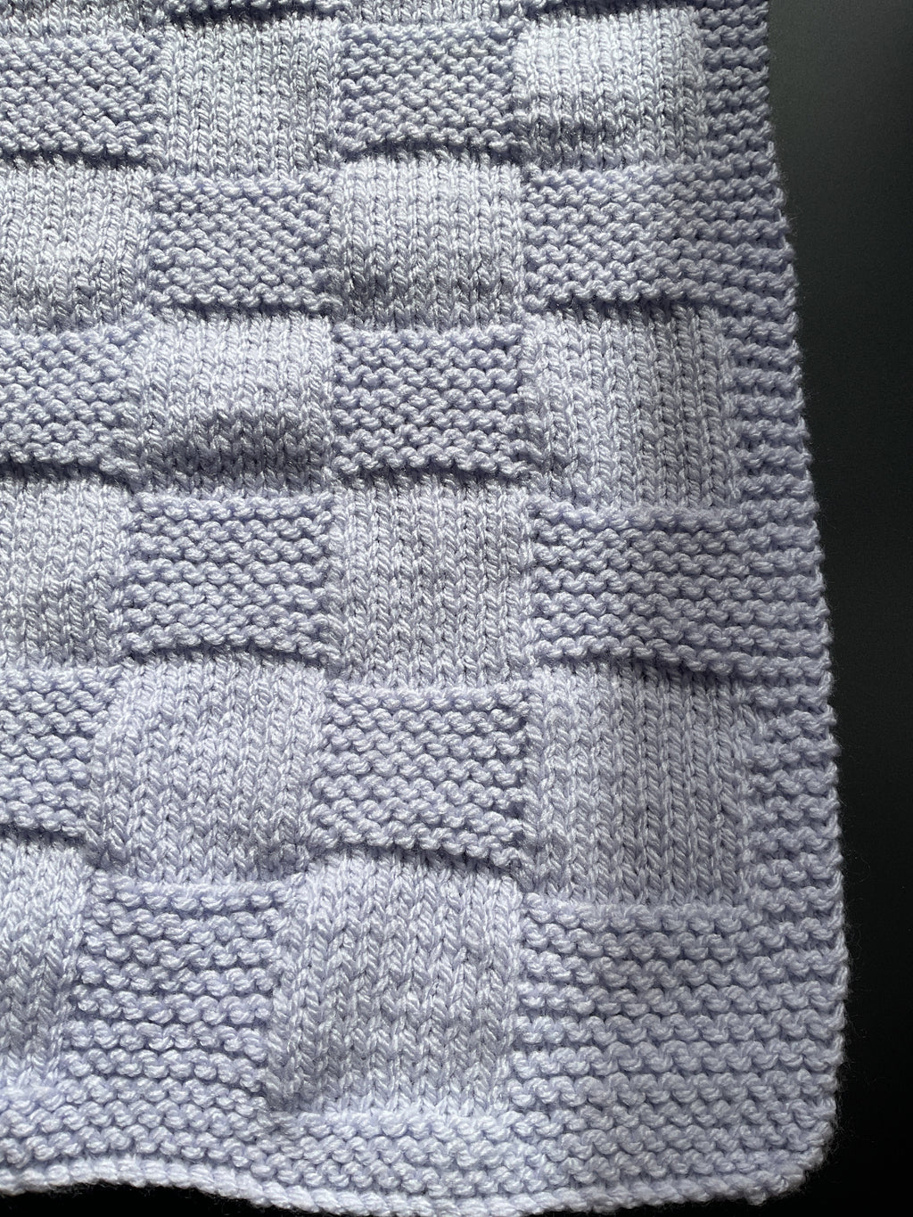Chunky knitted lilac baby blanket